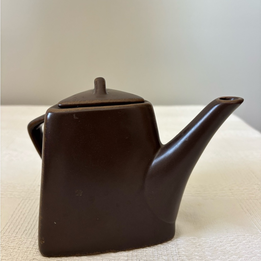 Designpac triangular brown teapot made of stoneware.